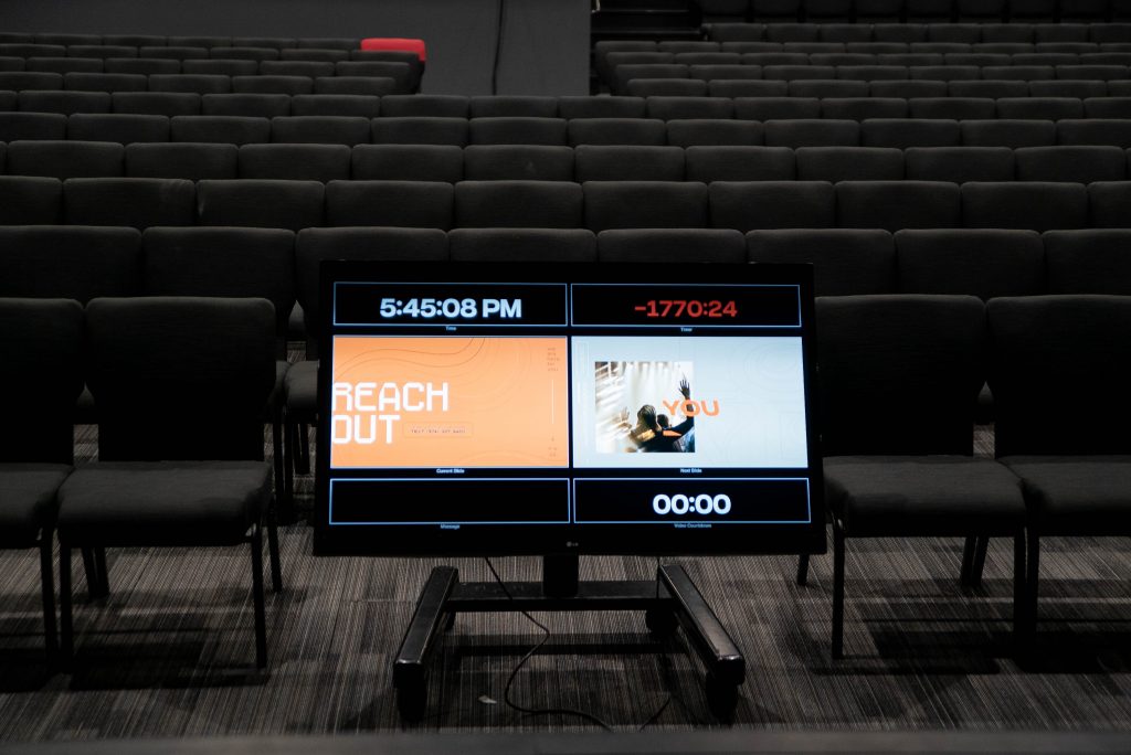 Presentation screens displaying cues to on-stage talent